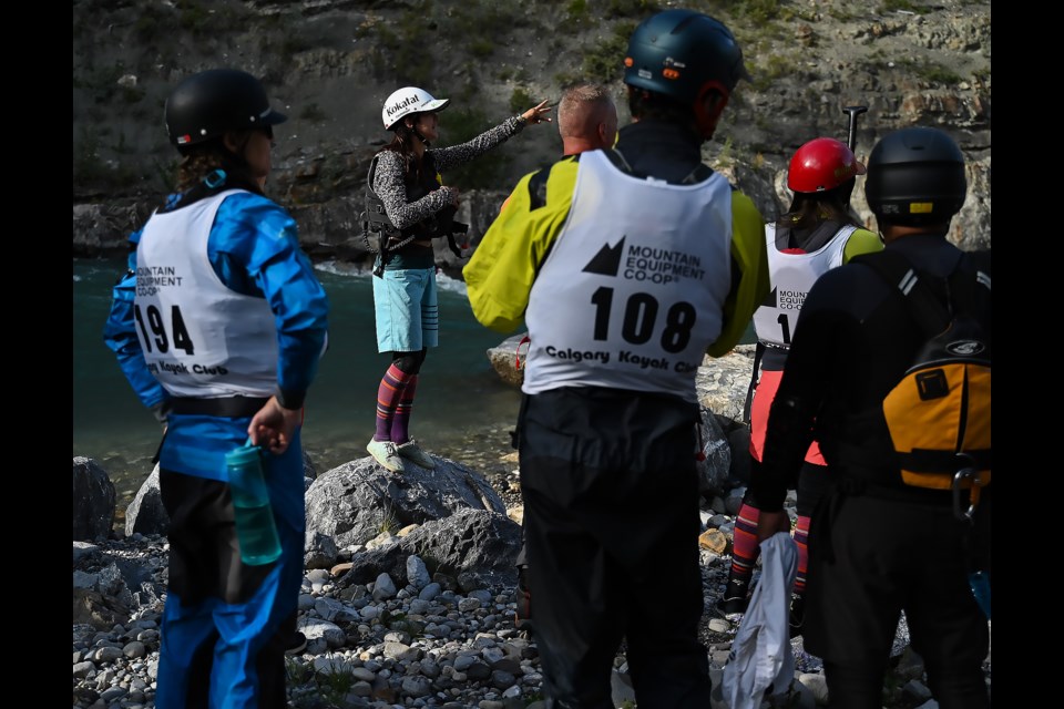 Reta Boychuk explains the course to the SUP Cross competitors in Kananaskis Country at Canoe Meadows on Friday (Aug. 11). KanFest is a three day whitewater festival with nine different white water competitions. MATTHEW THOMPSON RMO PHOTO