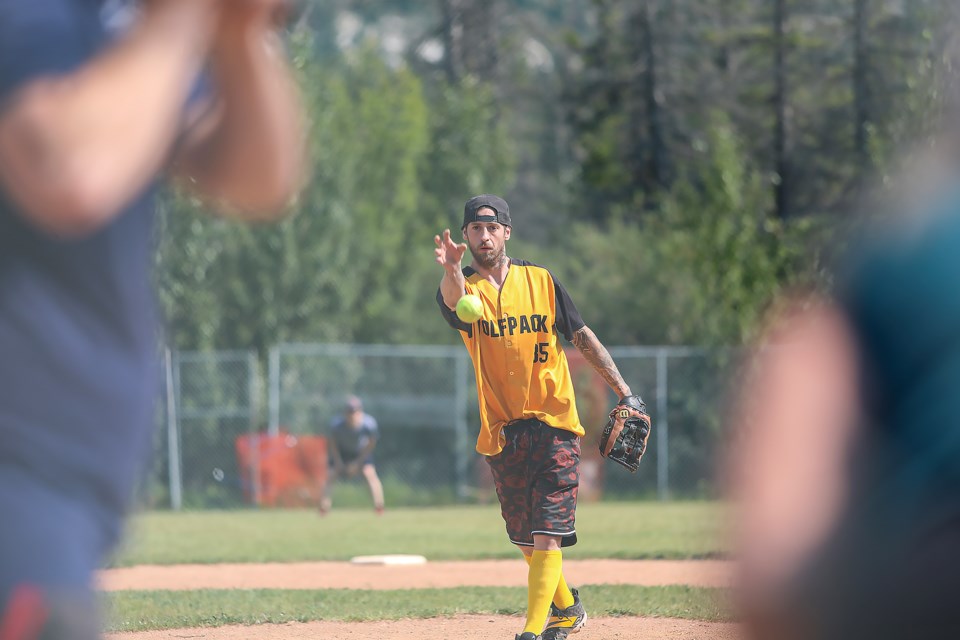 Brandon Blanchard pitches during the mini slo-pitch tournament at the Exshaw recreational grounds on Saturday (Aug. 19). JUNGMIN HAM RMO PHOTO