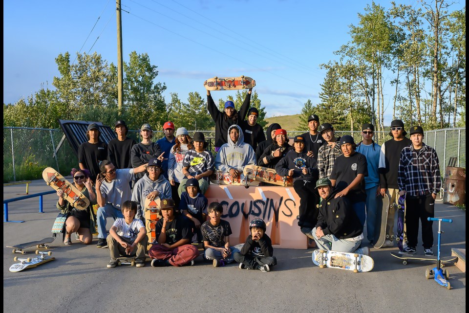 Skaters at the Cousins Skateboarding weekly skate session pose for a group photo in Mînî Thnî on Wednesday (Aug. 23). Cousins Skateboarding is a nonprofit that aims to empower Indigenous skate communities. MATTHEW THOMPSON RMO PHOTO