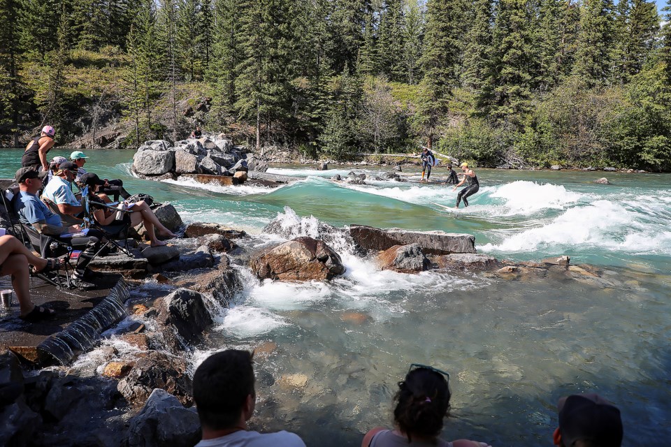 River surfer Trey Currie catches a wave in the Mountain Wave Classic Annual Surf Competition in Kananaskis Country on Saturday (Aug. 26). JUNGMIN HAM RMO PHOTO 