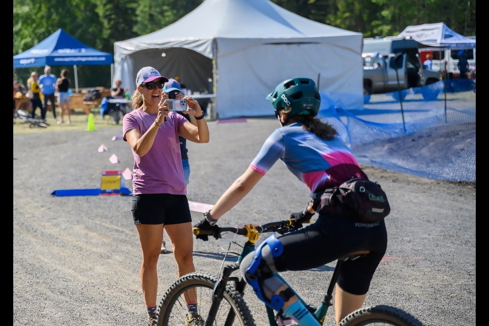 Aida Mills has her photo taken after finishing her tenth and final lap during the Canadian Rockies 24-hour bike at the Canmore Nordic Centre on Sunday (Aug. 27).  MATTHEW THOMPSON RMO PHOTO