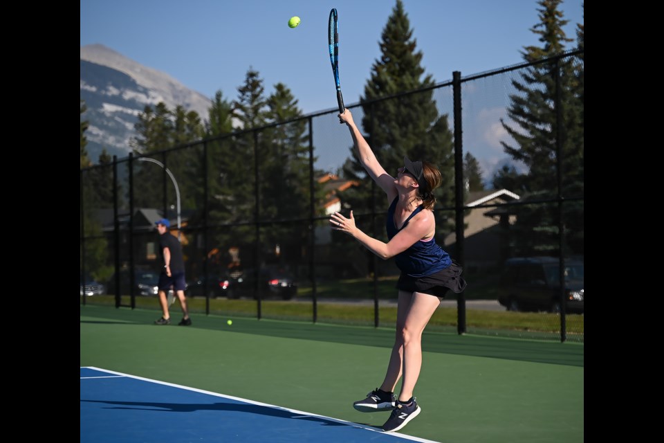 Rebecca Holeczi serves the ball during the finals of a singles championship match in Canmore at the Lions Park tennis courts on Sunday (Aug. 27).  MATTHEW THOMPSON RMO PHOTO