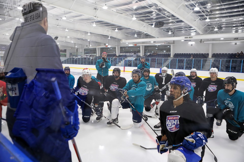 The Canmore Eagles listen on the first day of their training camp at the Canmore Recreation Centre on Tuesday (Aug. 29). JUNGMIN HAM RMO PHOTO 