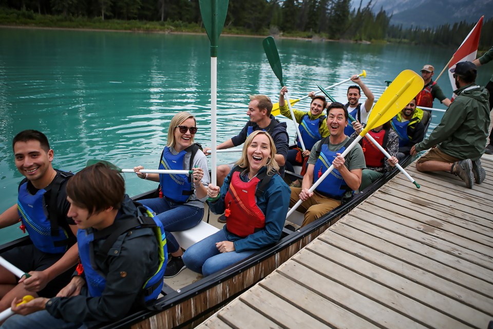 Arctos & Bird's paddlers shout out with excitement before Big Canoe Races start during the Canoe for a Cause 2023 event in Banff National Park on Wednesday (Aug. 31). JUNGMIN HAM RMO PHOTO 