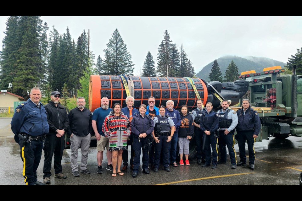 Members of Banff RCMP met with and escorted Kwakiutl master carver Stan Hunt and members of his family as they crossed the B.C.-Alberta border Thursday (Sept. 7) on a journey to deliver Hunt's 18-foot monument across the country in honour of residential school victims and survivors.

PHOTO COURTESY OF BANFF RCMP