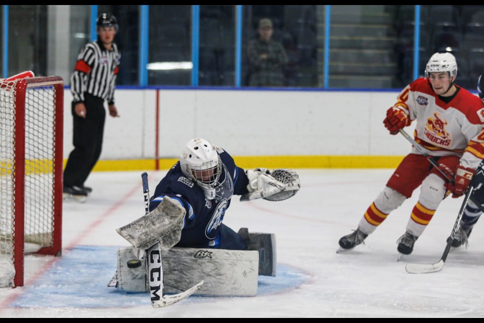 Canmore Eagles goaltender Matthew Malin makes a save off of a Calgary Canucks forward during the game at the Canmore Recreation Centre on Friday (Sept. 8). JUNGMIN HAM PHOTO