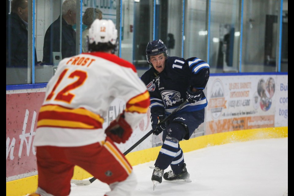 Owen Jones of the Canmore Eagles gets ready to pass the puck during an exhibition game against the Calgary Canucks at the Canmore Recreation Centre on Friday (Sept. 8). JUNGMIN HAM RMO PHOTO 