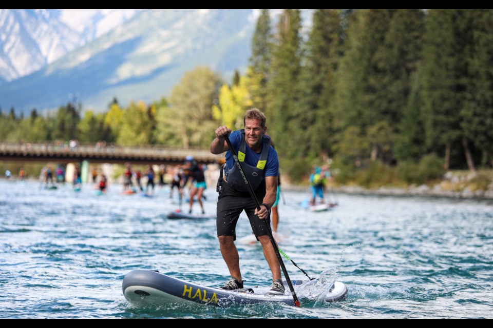 Corey Jespersen makes his way down the Bow river during the Bow Valley's 6th annual downriver SUP race Logjam from Riverside Park in Canmore to the Three Sisters overpass on Saturday (Sept. 9).  JUNGMIN HAM RMO PHOTO 
