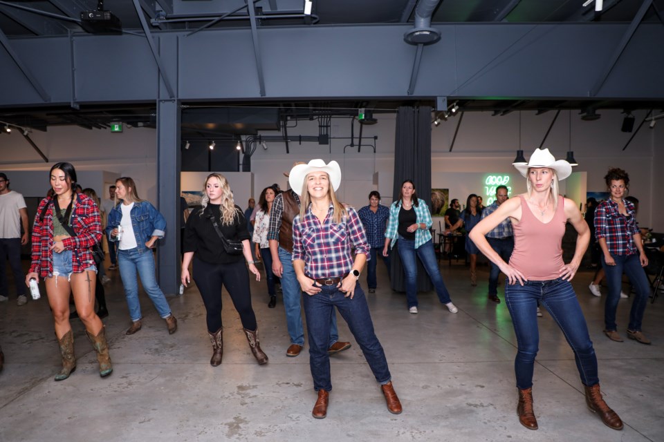 Line dancers practice a repeating sequence of steps during the Country Night event at CanGOLF in Canmore on Friday (Sept. 22).JUNGMIN HAM RMO PHOTO  