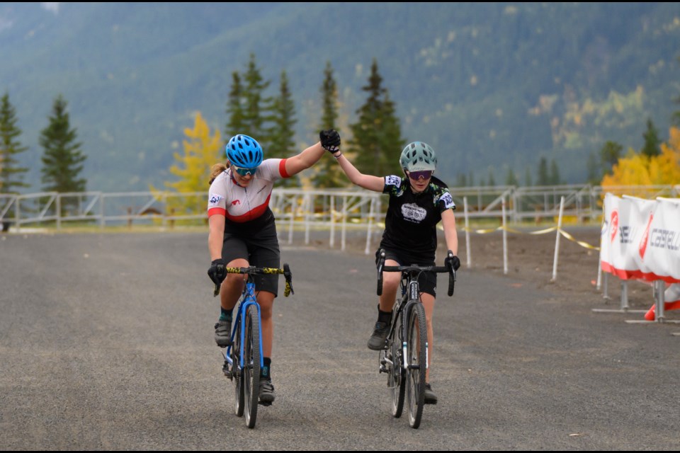 Alina Custodio, left, and Elané Ferguson, right, approach the finish line holding hands during the Drie Zussen Super Prestige at the Canmore Nordic Centre on Sunday (Sept. 24). The Drie Zussen Super Prestige is apart of a two-day bike race with the first day being Western Challenge CX. MATTHEW THOMPSON RMO PHOTO