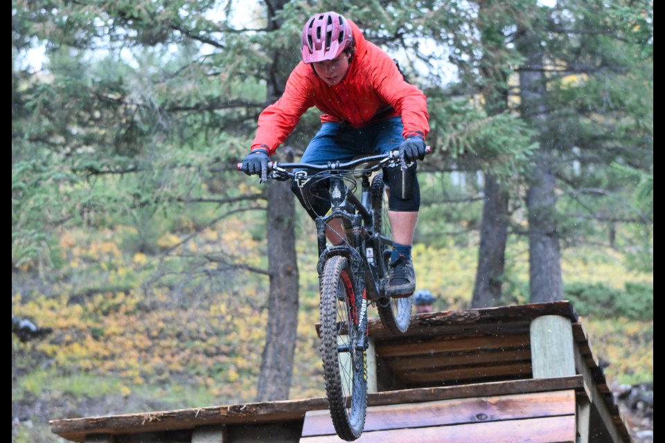 Matthew Cardinal rides off a drop in Canmore at the Benchlands Drop Zone on Tuesday (Sept. 26). The new Drop Zone includes eight short trails and 13 features. MATTHEW THOMPSON RMO PHOTO