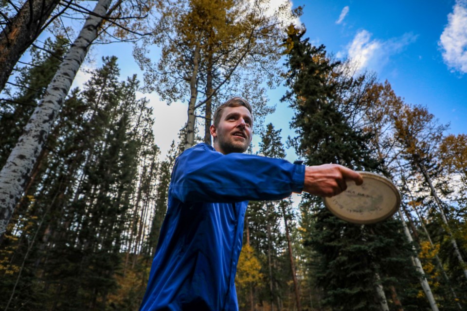 Ciaran Galts plays his tee shot on the first hole at Canmore Disc Golf course on Friday (Sept. 29). JUNGMIN HAM RMO PHOTO