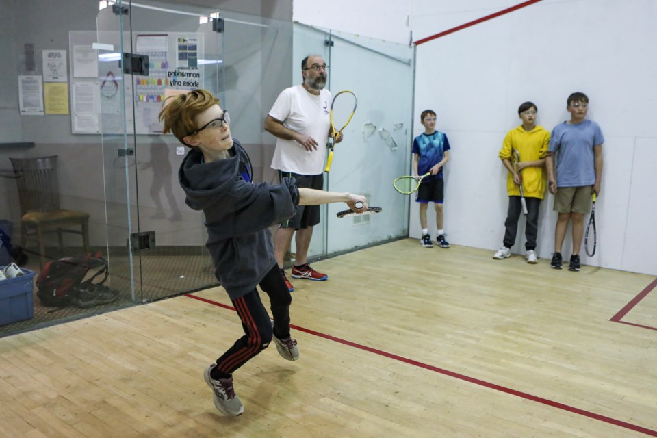 Evan Fox, 11, plays squash for the first time at a 'try-it' squash program hosted by the Bow Valley Squash Foundation on the squash courts at the Banff Rocky Mountain Resort in Banff on Thursday (Oct. 13). JUNGMIN HAM RMO PHOTO