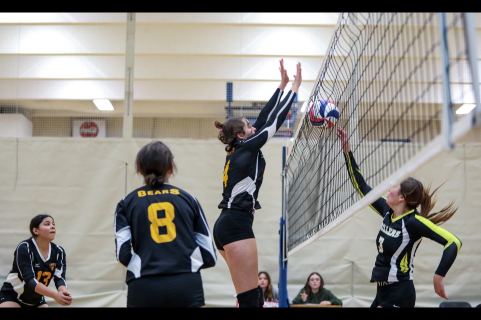 Banff Bears Breanne Carr blocks a tip by the Oilfields Drillers middle during the senior girls volleyball tournament at Banff Community High School on Friday (Oct. 13). JUNGMIN HAM RMO PHOTO