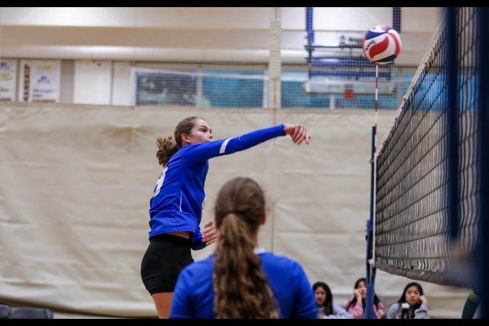OLS Avalanche Arianne Thomson leaps for a spike against the Cremona Cougars during the senior girls volleyball tournament at Banff Community High School on Friday (Oct. 13). JUNGMIN HAM RMO PHOTO