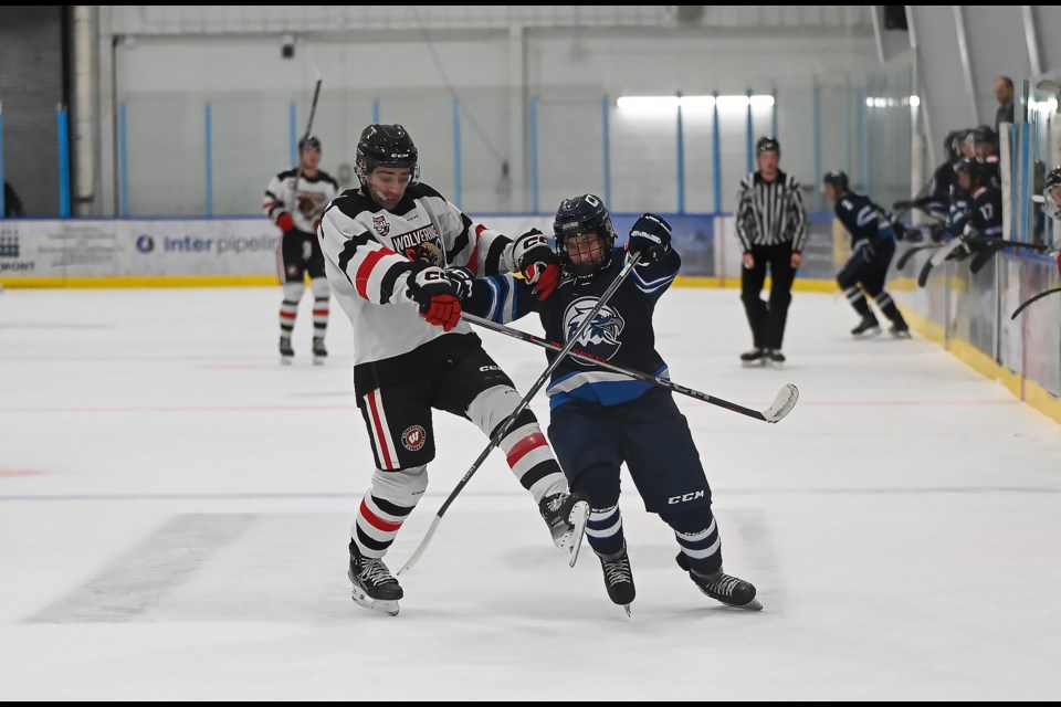 Whitecourt Wolverines Jack Franklin and Canmore Eagles Tavyn Schlant get tangled up in Canmore on Sunday (Oct. 15). The Canmore Eagles lost 0-7 against the Whitecourt Wolverines. MATTHEW THOMPSON RMO PHOTO