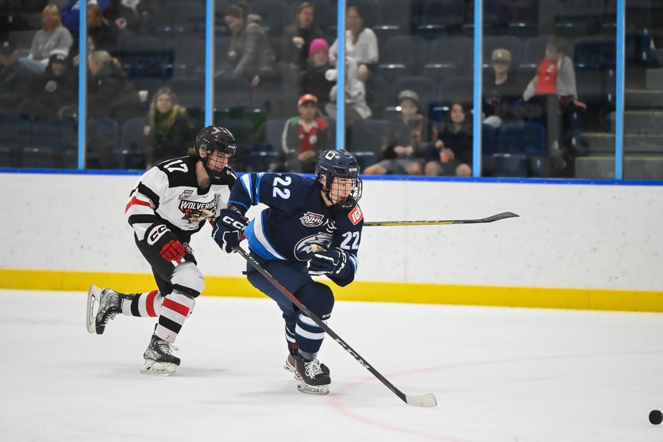 Canmore Eagles Haruki Morikawa and Whitecourt Wolverines Hunter Motley race for the puck in Canmore on Oct. 15, 2023. RMO FILE PHOTO