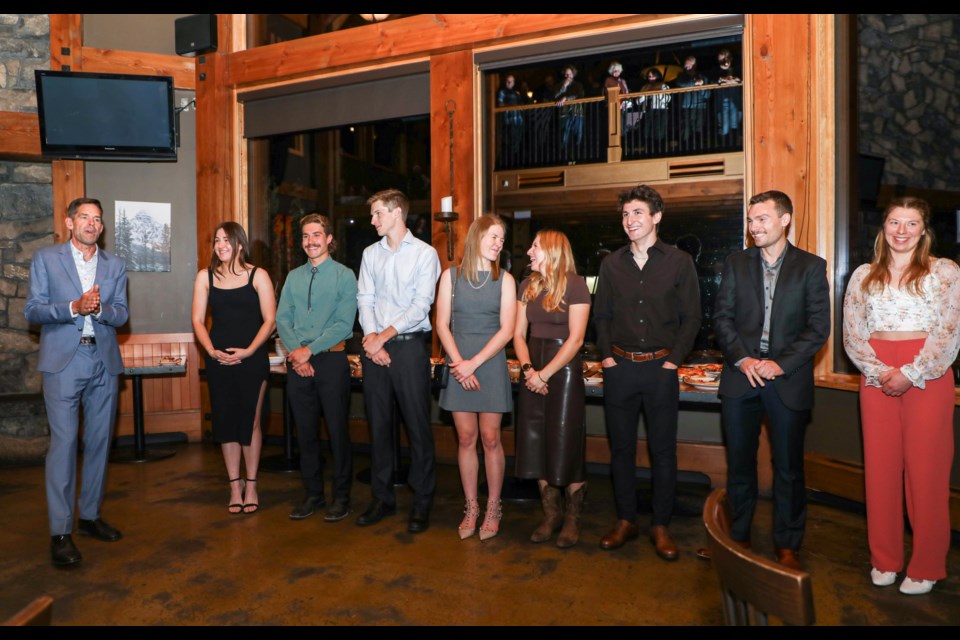Justin Wadsworth, left, head coach of the senior national team, introduces Canada's senior national biathlon team during the Shoot for Gold fundraiser event at Iron Goat in Canmore on Thursday (Oct. 19). From left: Benita Peiffer, Adam Runnalls, Logan Pletz, Emma Lunder, Jenna Sherrington, Zachary Connelly, Christian Gow and Nadia Moser. JUNGMIN HAM RMO PHOTO