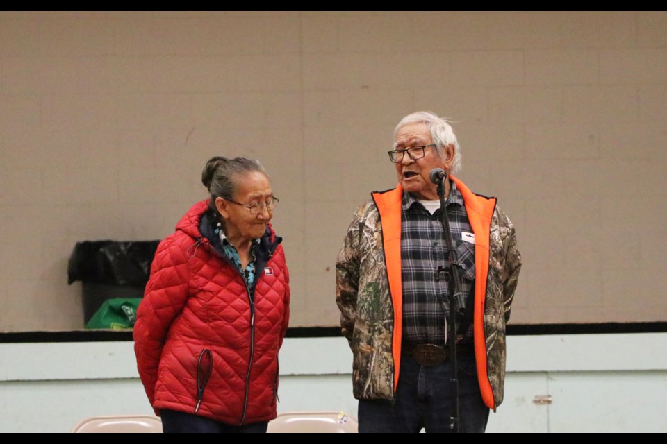 Elders Pauline and J.R. Twoyoungmen address a crowd of about 50 people at the Morley Gymnasium in Mînî Thnî Thursday (Oct. 19). Îyârhe Nakoda First Nation elders called for a meeting with the Nation's chiefs and council over financial transparency concerns.

JESSICA LEE RMO PHOTO