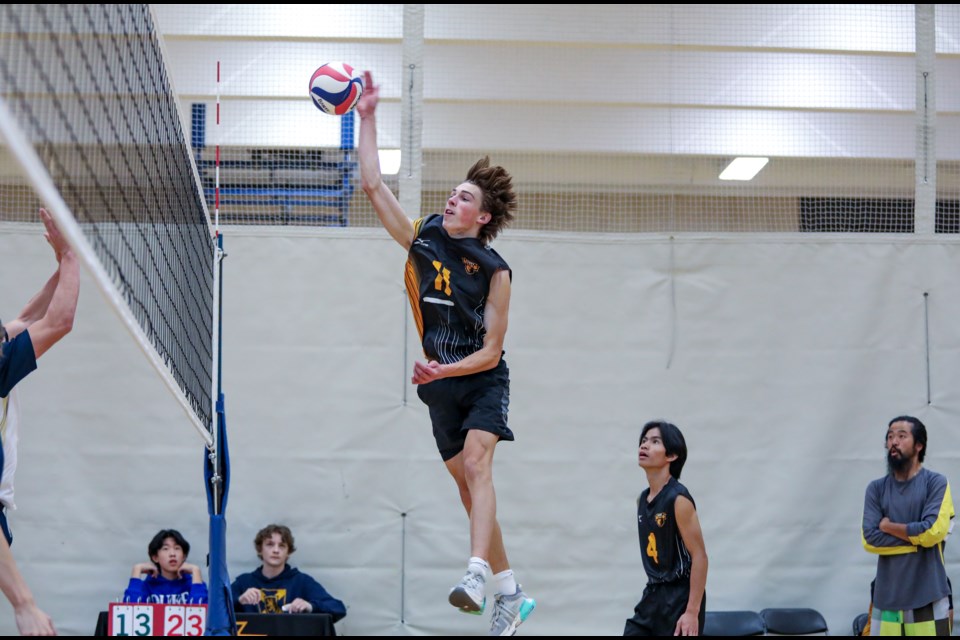 Banff Bears Macsen Hempstead leaps for a spike against the Bow Valley High School Bobcats in the senior boys volleyball tournament at Banff Community High School on Friday (Oct. 20). The Bears won in two sets. JUNGMIN HAM RMO PHOTO 