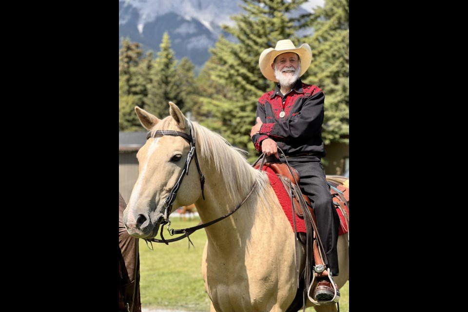 Stan Cowley rides Tucker, his son David's horse, at the Canada Day parade in Canmore in July 2022. 

PHOTO COURTESY OF ALANNA GIBSON