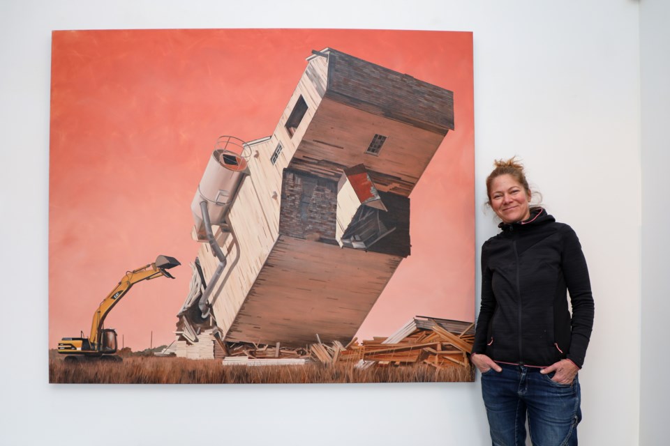 Canmore artist Pascale Ouelett poses with her painting  “Vanishing Landmark 6” at Elevation Gallery on Main Street in Canmore on Thursday (Oct. 26). JUNGMIN HAM RMO PHOTO 
