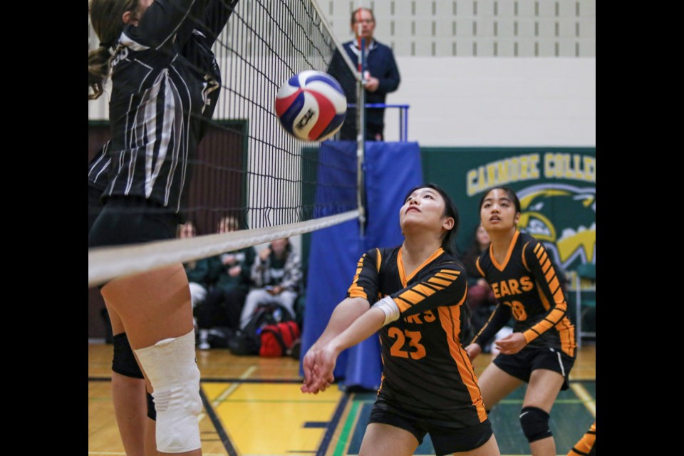 Banff Bears Kitomi Takano tries to send one over the net against the George McDougall Mustangs in the JV girls volleyball tournament at Canmore Collegiate High School on Friday (Oct. 27). JUNGMIN HAM RMO PHOTO