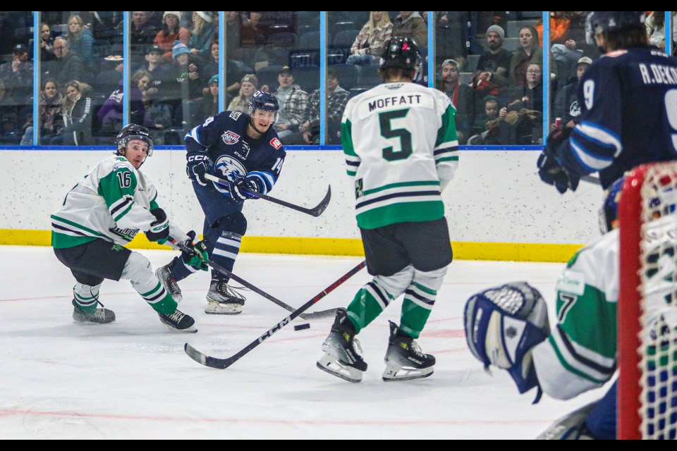 Canmore Eagles Logan Ziegler blasts a shot through the Drayton Valley Thunder defenders at the Canmore Recreation Centre on Friday (Oct. 27). The Eagles beat the Thunder 3-2. JUNGMIN HAM RMO PHOTO 