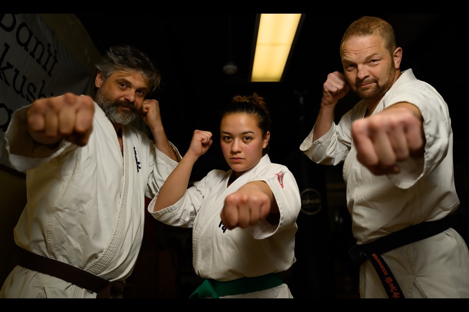 Francois Pace, left, Mya Firlotte, middle, and Daymon Miller, right, of Banff Kyokushin Karate pose for a portrait at their dojo in Banff on Monday (Nov. 6). MATTHEW THOMPSON RMO PHOTO