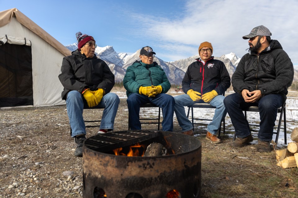 Stoney elders John Wesley, left, and Henry Holloway, Chiniki First Nation Chief Aaron Young and Simpcw First Nation Chief George Lampreau during a historic gathering of the Simpcw and Stoney Nations in Jasper National Park Oct. 27-28. 

PHOTO COURTESY OF PARKS CANADA
