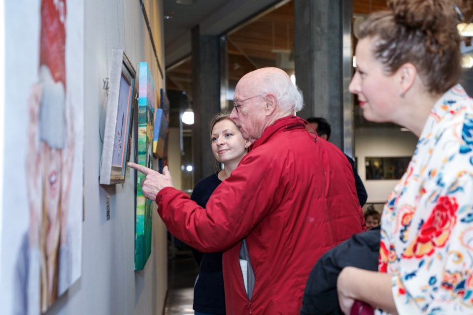 Art lovers appreciate works of art at the Kinship exhibition at Three Sisters Gallery in Canmore on Thursday (Nov. 9). Kinship exhibition will be running at Three Sisters Gallery until Jan. 31, 2024. JUNGMIN HAM RMO PHOTO