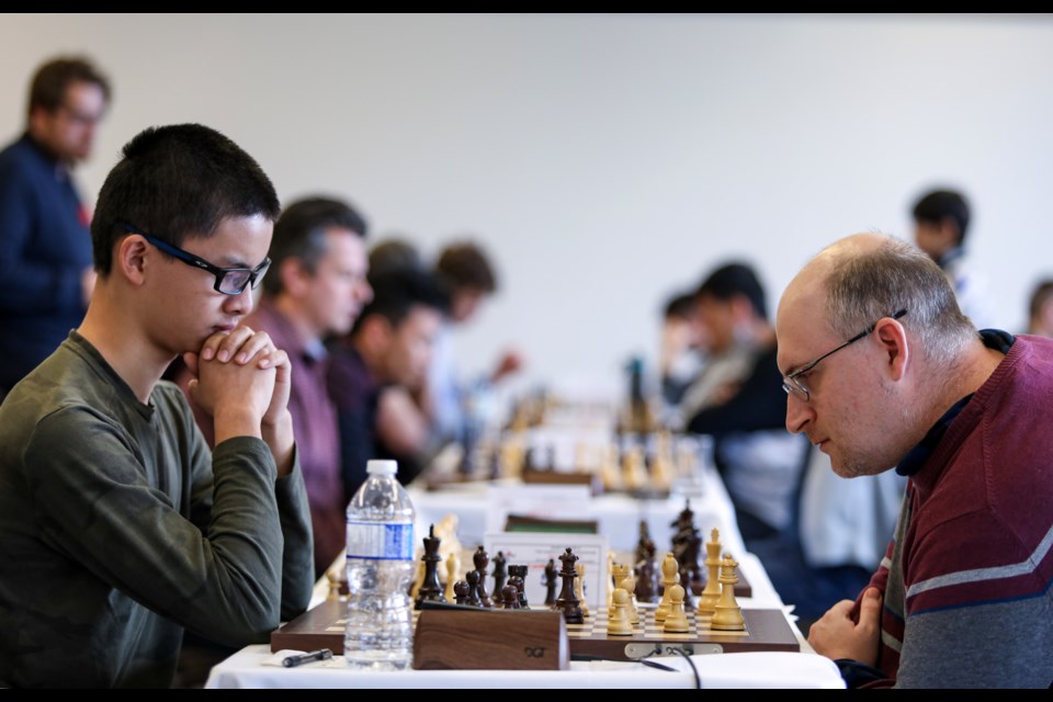 Raymond Kaufman, who received the International Chess Federation (FIDE) title of International master in 2008, plays against Eric Jin in the 2023 Banff Open tournament held at the Banff Centre for Arts and Creativity on Friday (Nov.10). The 2023 Banff Open tournament began on Friday (Nov.10) and ran until Sunday (Nov. 12).  JUNGMIN HAM RMO PHOTO