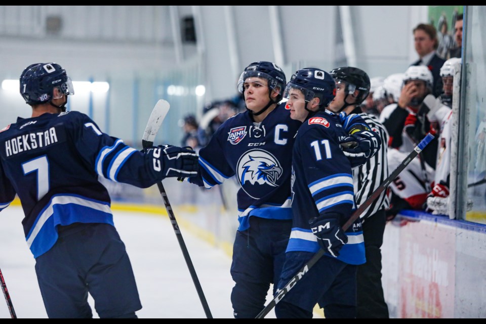 Canmore Eagles Owen Jones rejoices with teammates after scoring the first goal against the Camrose Kodiaks at the Canmore Recreation Centre on Friday (Nov. 10). The Eagles beat the Kodiaks 4-2. JUNGMIN HAM RMO PHOTO 