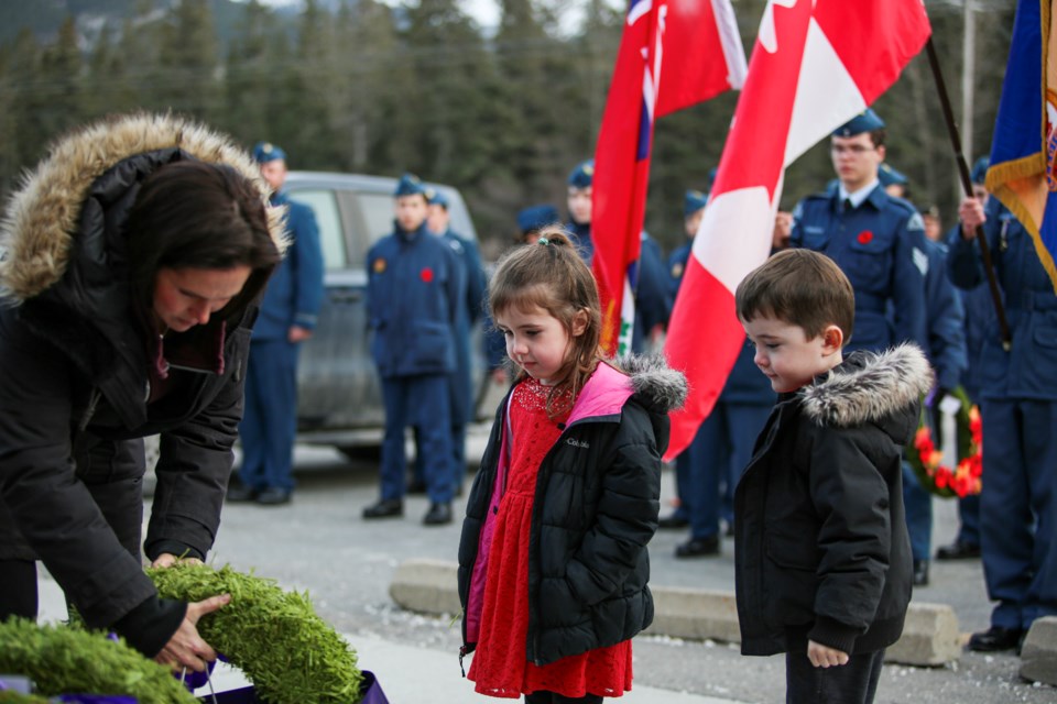 Jacqueline Barr, left, Rhyan Barr and Logan Barr lay a wreath during the Remembrance Day events at the Royal Canadian Legion No. 26 Col. Moore branch in Banff on Saturday (Nov.11). JUNGMIN HAM RMO PHOTO 