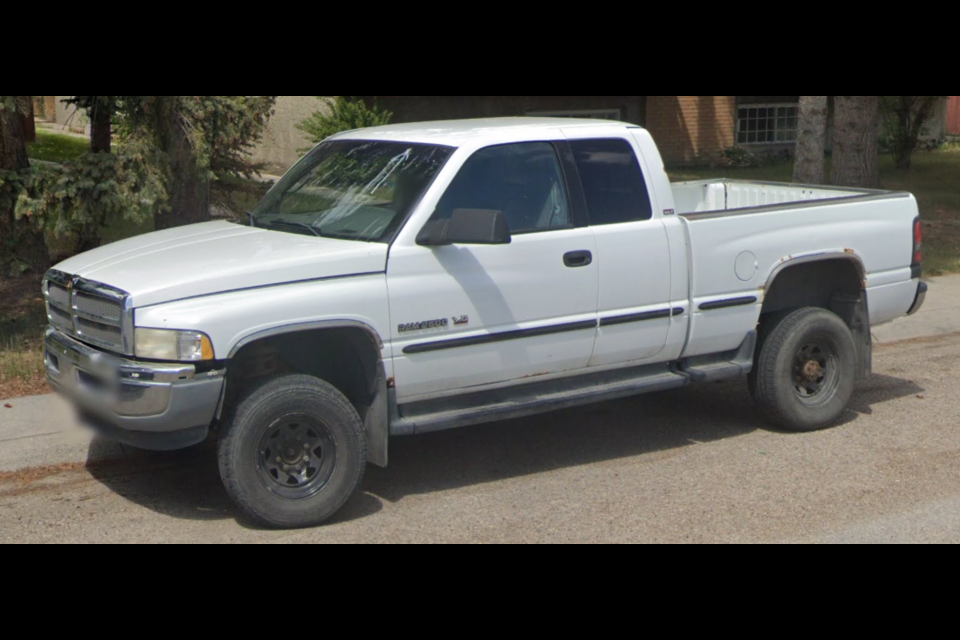 Police are requesting any information from the public regarding a stolen 1998 white Dodge Ram with Alberta licence plate CNF1057. Authorities are investigating after the truck was discovered at a trailhead in Kananaskis Country last week with human remains inside. 

RCMP PHOTO
