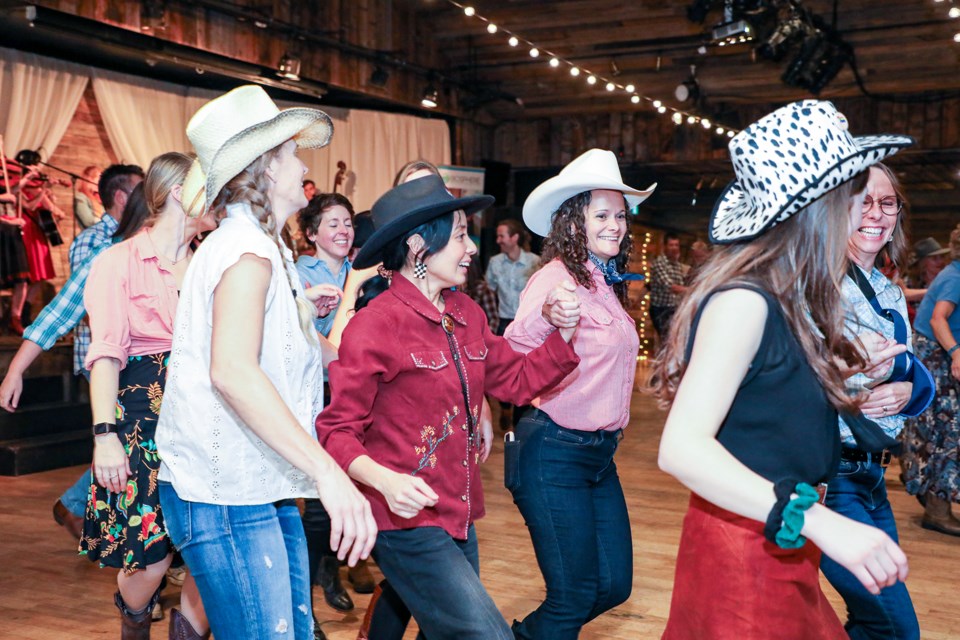Dance goers enjoy Friday night with "Do-Si-Dos" at the Biosphere's second annual Square Dance Community Fundraiser at the Cornerstone Theatre in Canmore on Friday (Nov. 17). JUNGMIN HAM RMO PHOTO