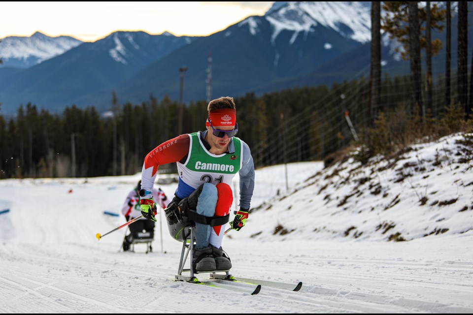 Canadian Paralympian Derek Zaplotinsky races during the men's 5 km sitting race in the 2023 FIS Para Canmore Continental Cup at the Canmore Nordic Centre on Tuesday (Nov. 21). JUNGMIN HAM RMO PHOTO