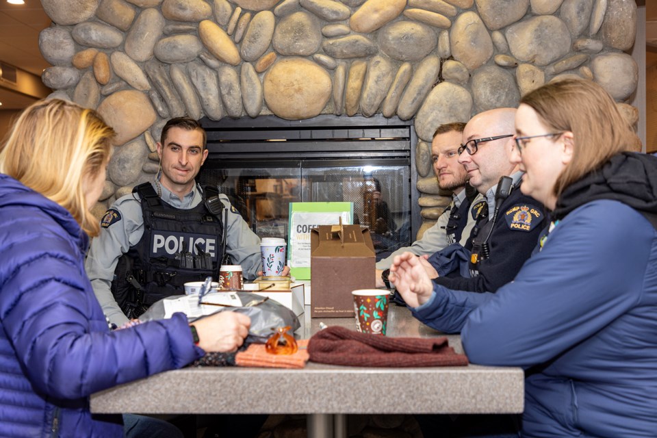 Banff residents and local Banff RCMP officers have a chat during Coffee With a Cop at McDonalds in Banff on Wednesday (Dec. 6). From left: Banff resident Randi Biederman, Banff RCMP Const. Riley Clendining, Const. David Little, Cpl. Jason Dyment and Banff resident Larissa Barlow. JUNGMIN HAM RMO PHOTO