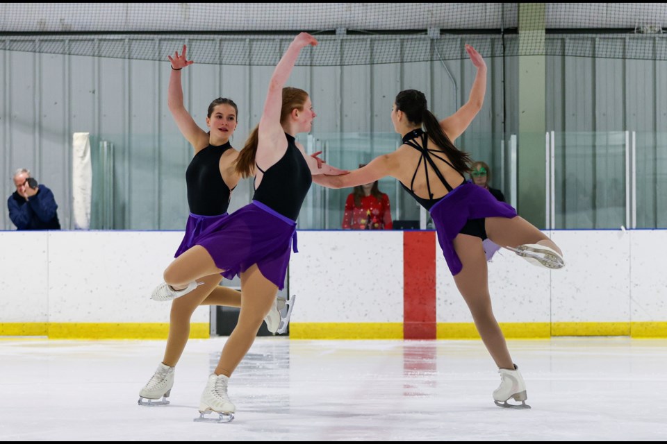 Local skaters Hazel Schmaltz, left, Paige Domenico and Maya Gonzalez perform the "Cozy Little Christmas" routine at Canmore Skating Club's annual winter gala, Winter Whirl Magic on Ice, at Canmore Recreation Centre on Thursday (Dec. 14). JUNGMIN HAM RMO PHOTO