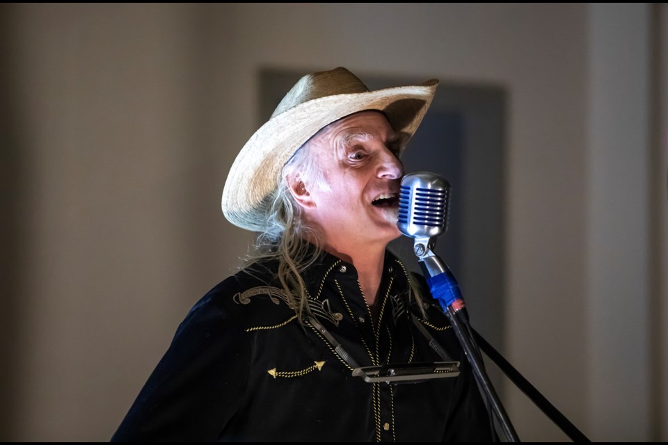 Garry Gonis sings during the Singing Tree Coffee House's final days of 2023 at St. George's in the Pines Anglican Church in Banff on Thursday (Dec. 28). JUNGMIN HAM RMO PHOTO 