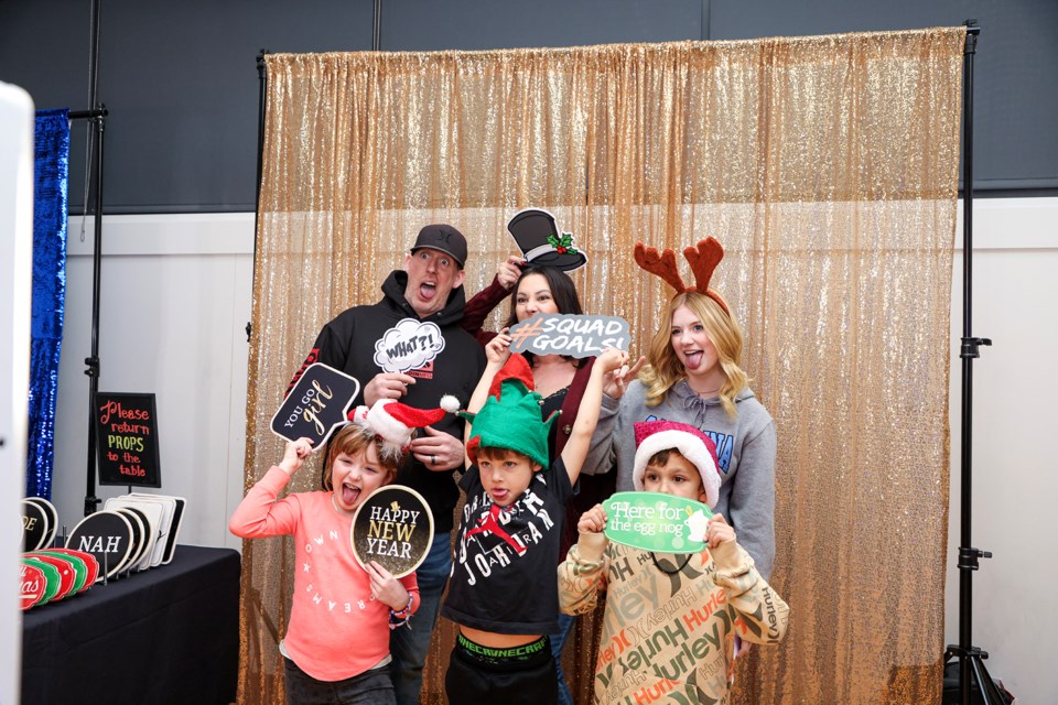 Family members from Brazil take pictures at the photobooths at the Canmore New Year's Eve celebration DJ dance party at Canmore Recreation Centre on Sunday (Dec. 31). Clockwise from top left: Barry Lepard, Allison Lepard, Scarlett Lepard, Cooper Nidd, Carver Nidd and Victoria Lepard. JUNGMIN HAM RMO PHOTO