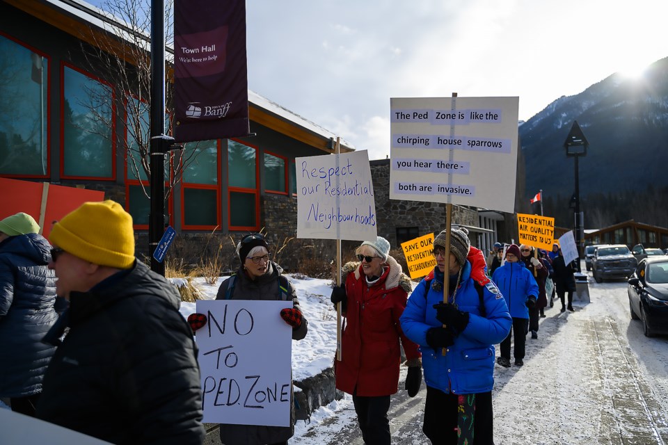 Protesters walk to Banff town hall to voice their opinion against the seasonal pedestrian zone on Banff Avenue in Banff on Monday (Jan. 8). MATTHEW THOMPSON RMO PHOTO