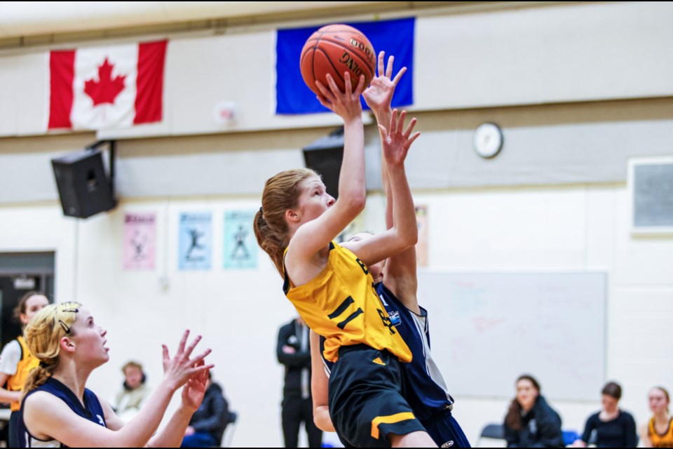 Banff Bears Stella Geestman tries a layup shot against the Our Lady of the Snows Avalanche during a senior girls game at Banff Community High School on Thursday (Jan. 11). The Bears beat the Avalanche 67-20.  JUNGMIN HAM RMO PHOTO