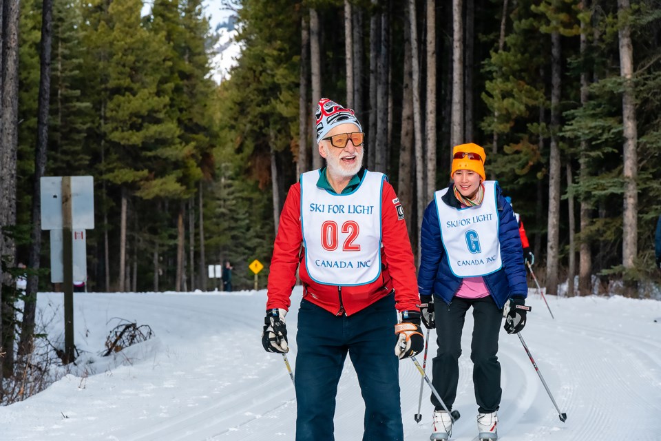 Bill McKeever, left, cross-country skis with guide Karen Tham at Ski for Light Canada 2023 at William Watson Lodge in Kananaskis Country. The event pairs visually impaired skiers with guides and returns to the lodge Jan. 22-28, 2024.

PHOTO COURTESY ALAN LAM PHOTOGRAPHY