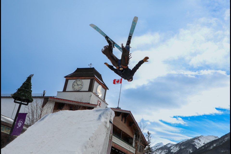 Slider Cole Carey performs a stunt skiing trick during the Snow Days Winter Festival skijoring on Banff Avenue on Saturday (Jan. 20). JUNGMIN HAM RMO PHOTO 