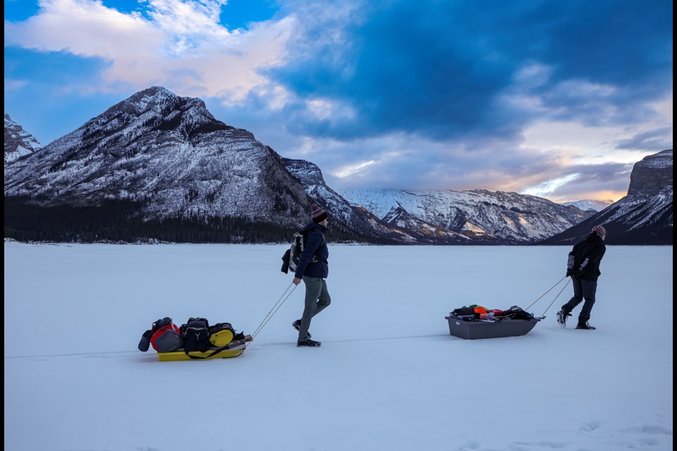 Freedivers Gerardo Haelewyn from Mexico, right, and Dakota Doolaege from Edmonton haul their dive equipment on sleds across Lake Minnewanka in Banff National Park on Saturday (Jan. 27). JUNGMIN HAM RMO PHOTO 