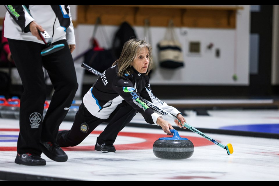 Team Brooks' Val Murray slides a stone during the ladies bonspiel at the Canmore Golf and Curling Club on Friday (Feb. 2). JUNGMIN HAM RMO PHOTO