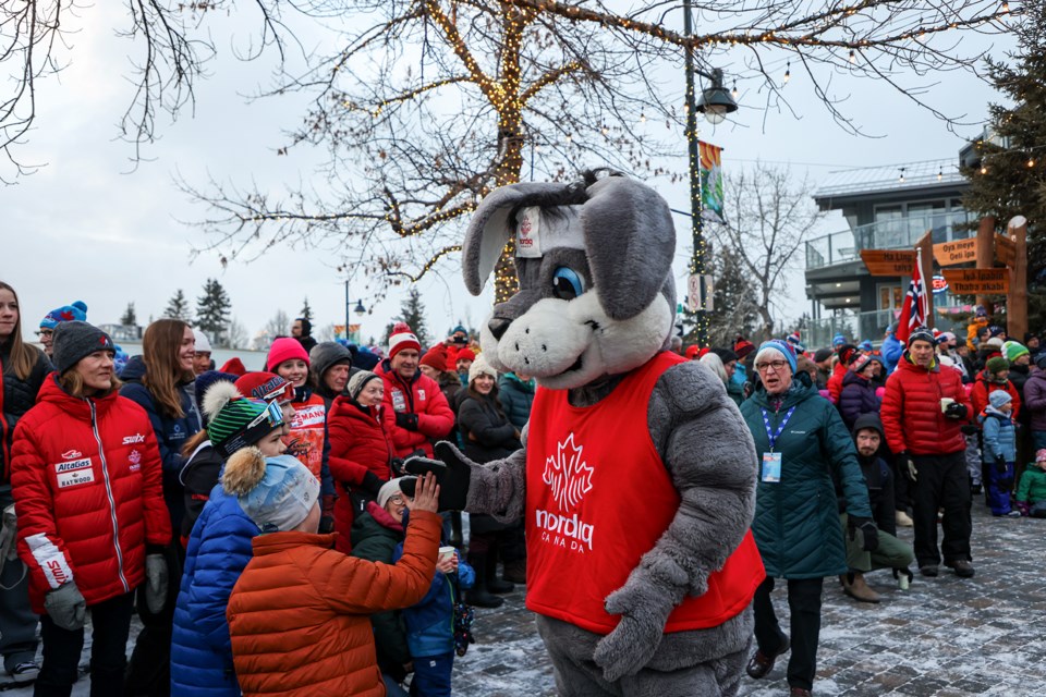 Klister, Nordiq Canada's official mascot, gives out high fives at the COOP FIS Cross Country World Cup opening ceremony at Canmore Civic Centre on Thursday (Feb. 8). JUNGMIN HAM RMO PHOTO 