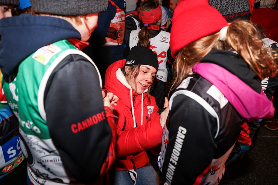 Canmore’s Anna Parent signs autographs during the COOP FIS Cross Country World Cup opening ceremony at Canmore Civic Centre on Thursday (Feb. 8). JUNGMIN HAM RMO PHOTO 
