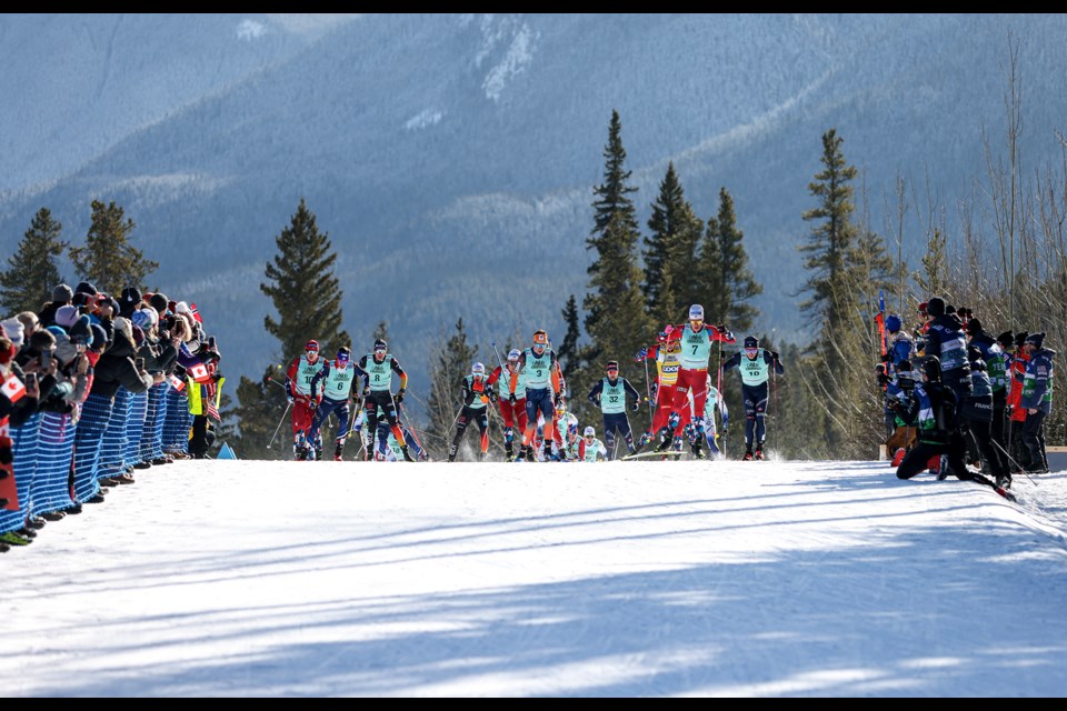 Spectators cheer on the World Cup skiers in the men's 15km mass start freestyle during the 2024 COOP FIS Cross Country World Cup at the Canmore Nordic Centre on Friday (Feb. 9). JUNGMIN HAM RMO PHOTO